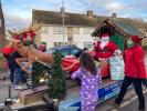 Santa visits one of the worst affected areas in Slade Close on Christmas Day morning.
